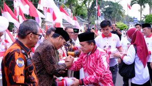Gubernur Al Haris Lepas Kirab Peringatan 10 Muharram Serta Santuni Ribuan Anak Yatim