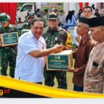 Tim Wasev TMMD Ke-129 Lakukan Aksi Sosial Bagikan Paket Sembako Ke Warga Desa Tanjung Agung